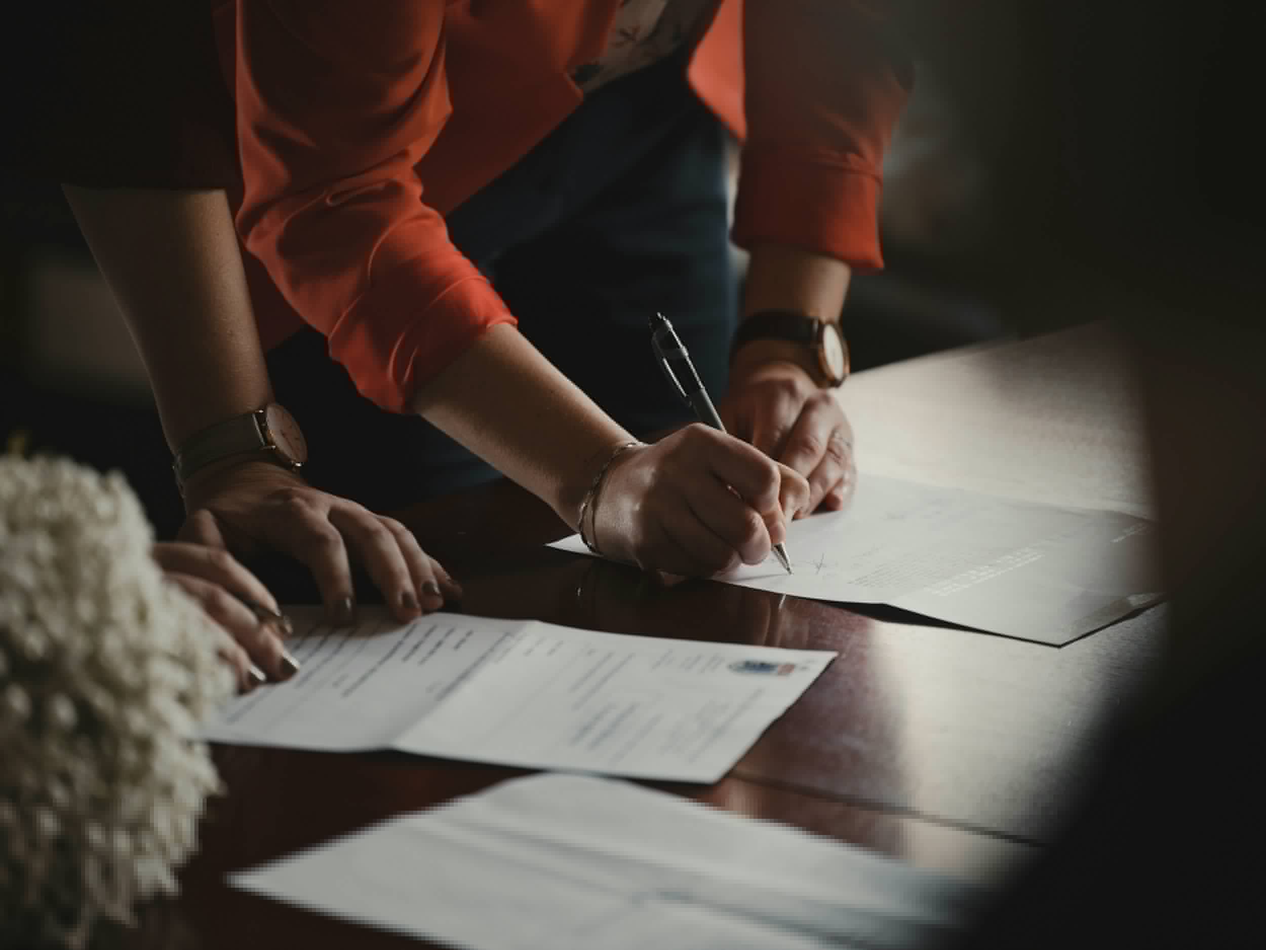 People working together on application paperwork